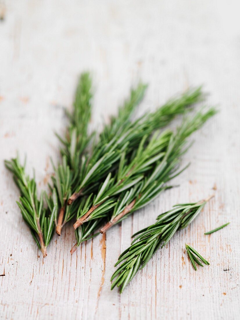 Fresh rosemary on wooden background