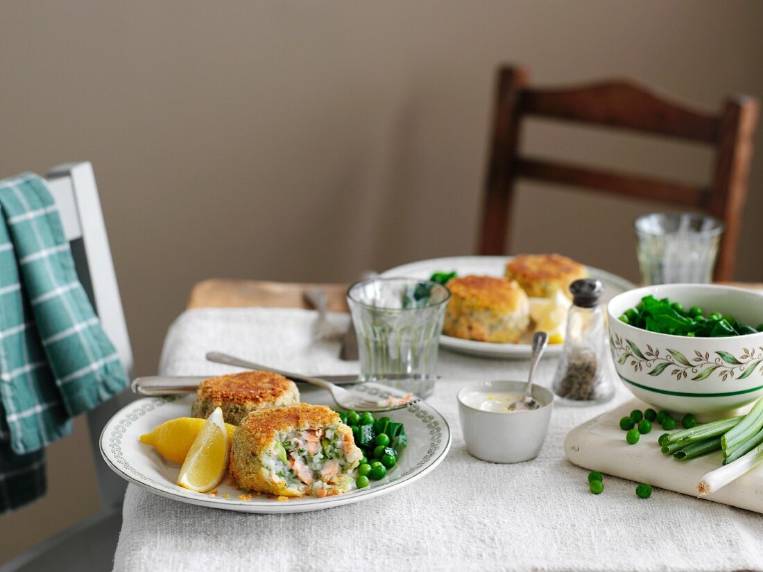 Salmon cakes with herbs and peas