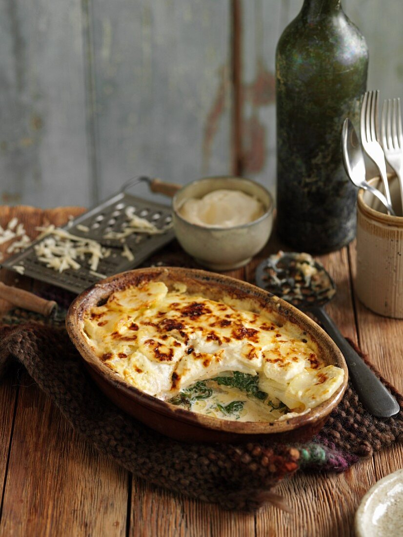 Spinach and potato gratin with cheese