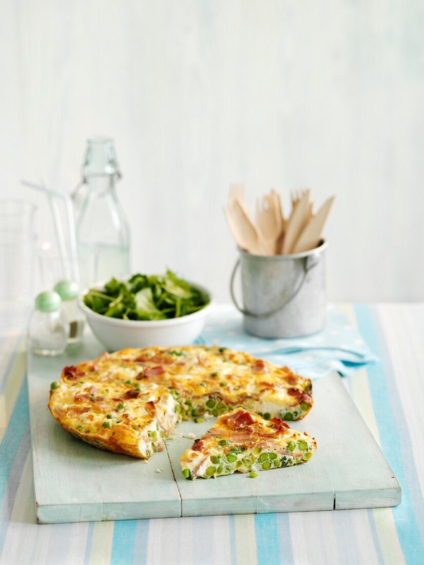 Frittata with peas, partly sliced