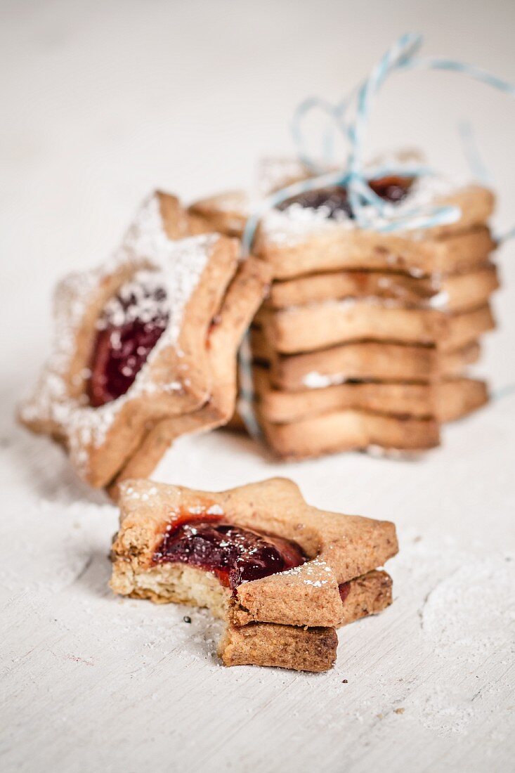 Cookie tower with ribbon and jelly filled cookie with a bite taken out of it