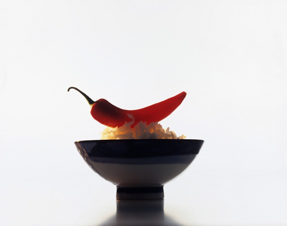 Asian eating bowl with rice and a chilli