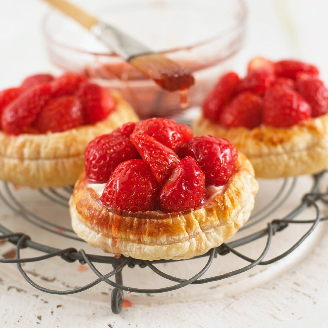 Strawberry tartlets on cooling rack