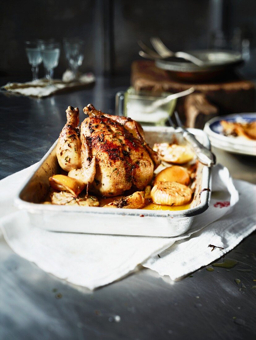 Roast chicken with lemons, onions and thyme