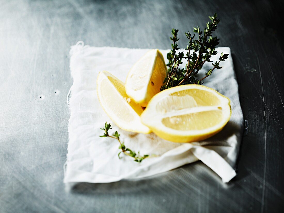 Lemon and fresh thyme on a cloth