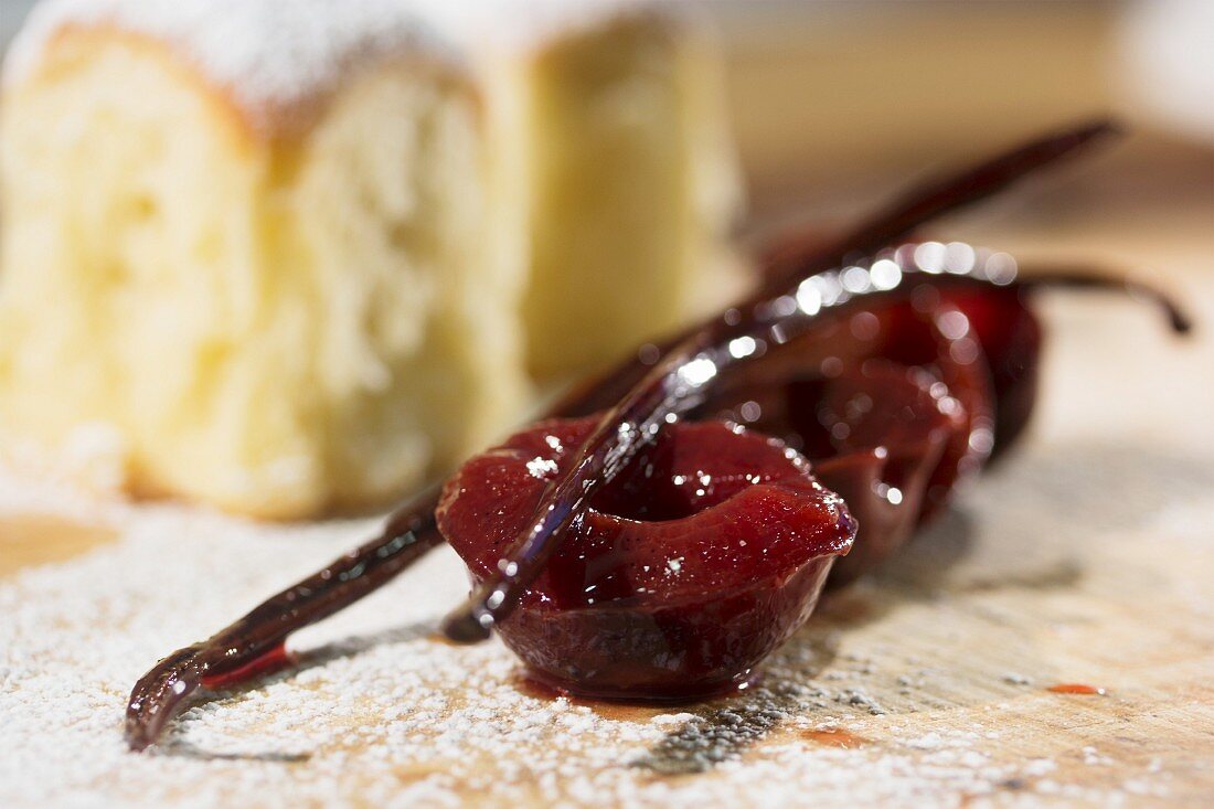Bavarian yeast-raised pastry with icing sugar, preserved plums and vanilla pods