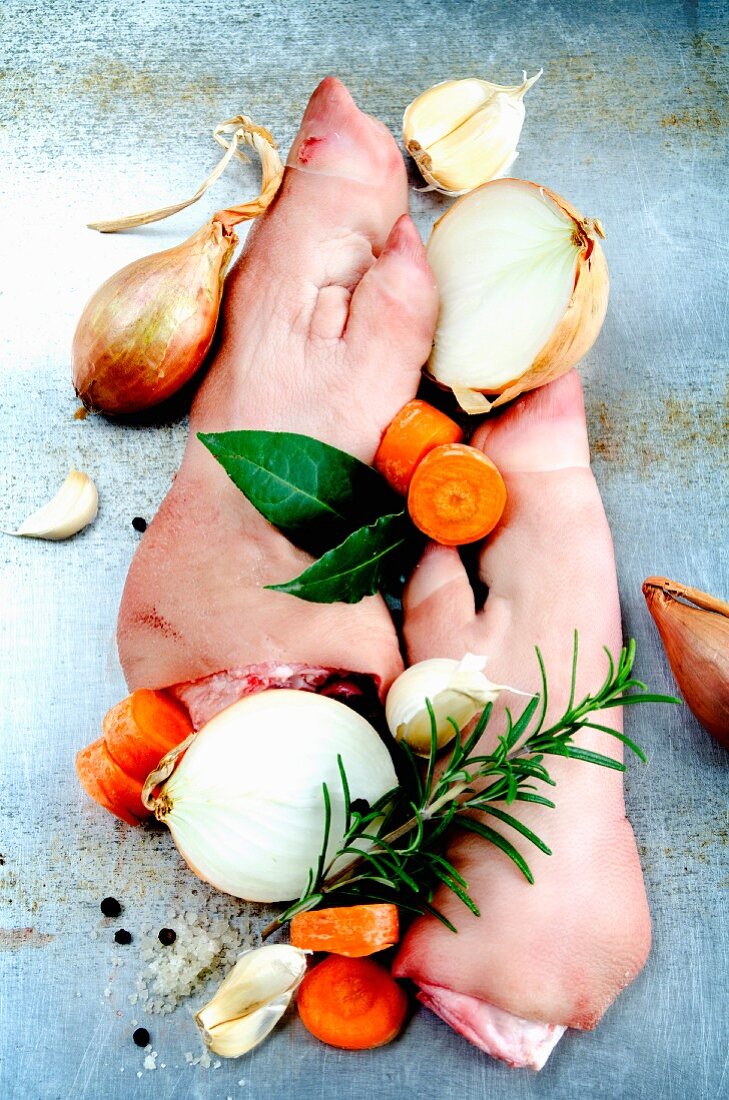 Pig's trotters with stock vegetables and herbs
