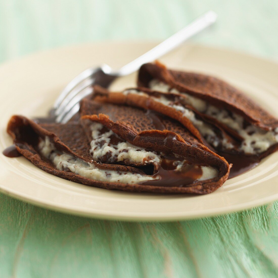 Chocolate crepes with cream filling