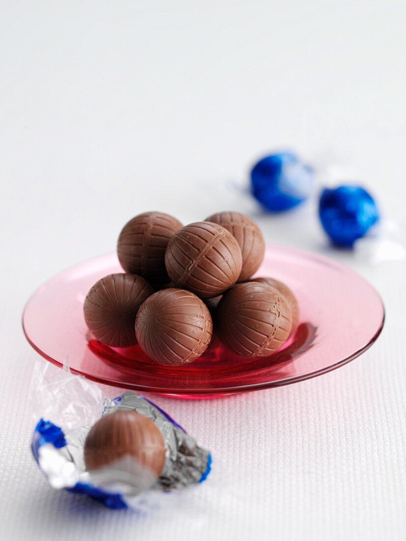 Chocolate truffles on a glass plate