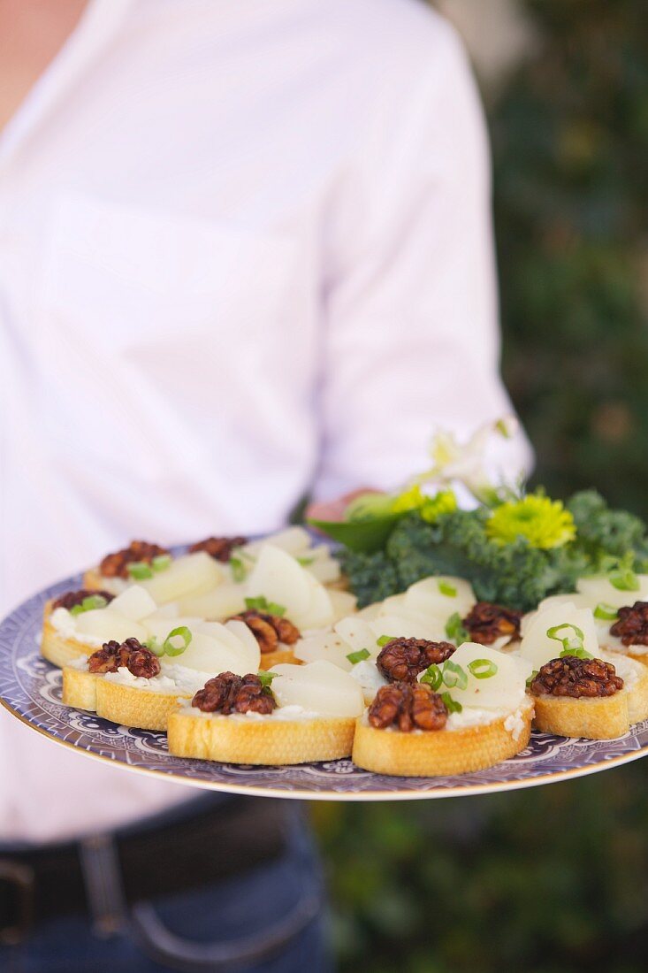 A Platter of Toasts with Cheese, Walnits and Scallions