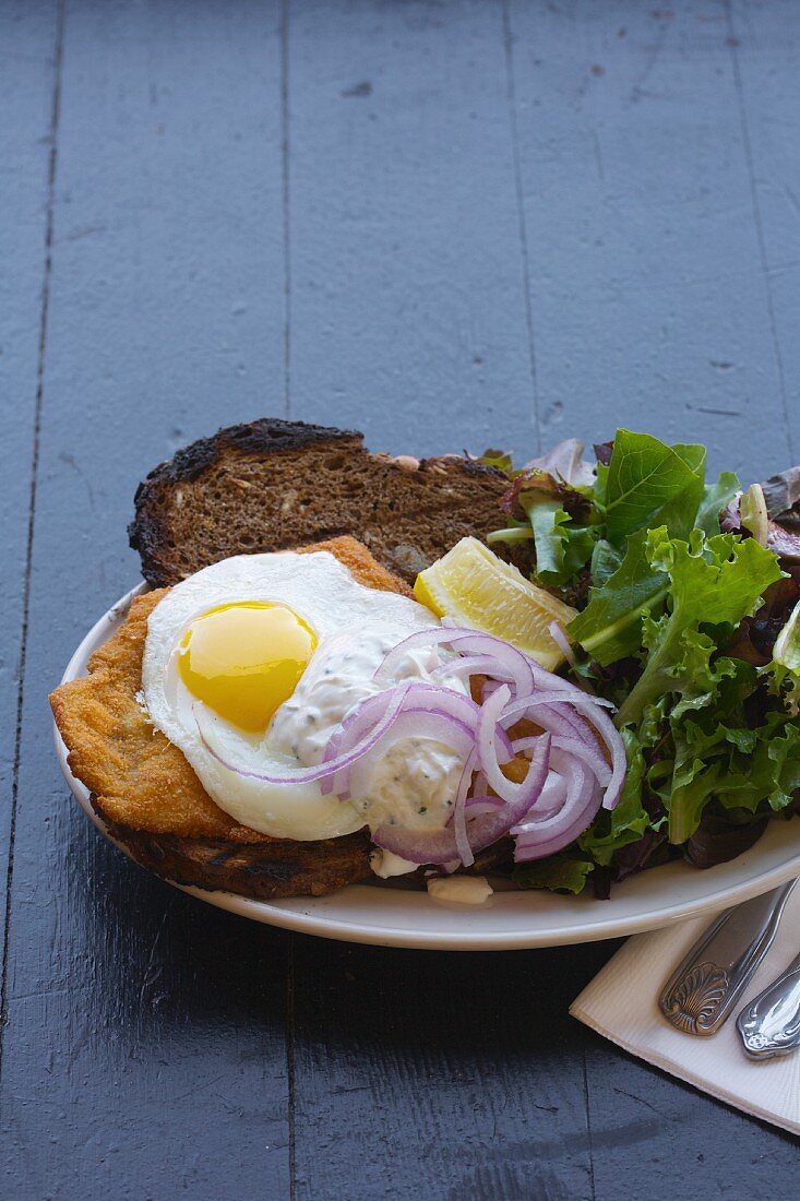 A Pork Schnitzel Sandwich with a Fried Egg