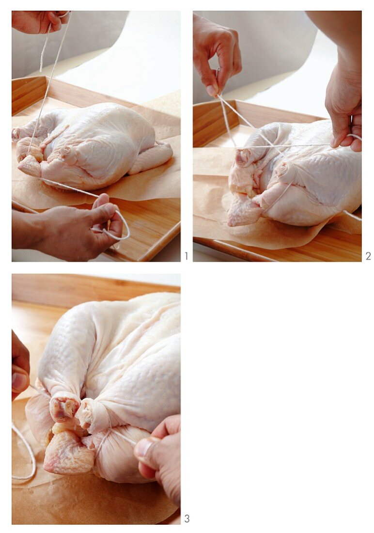 A chicken being tied for roasting