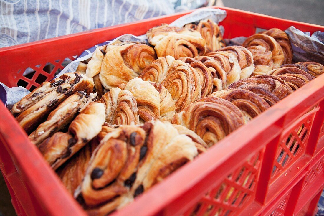 A crate of Danish pastries at a bakery
