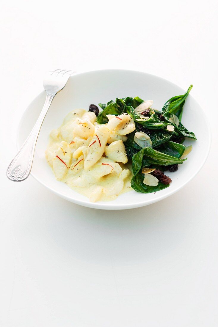 Chunks of sole with almond spinach
