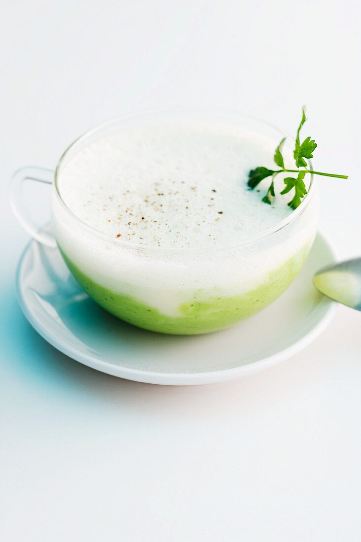 Creamy herb soup with parsley root foam