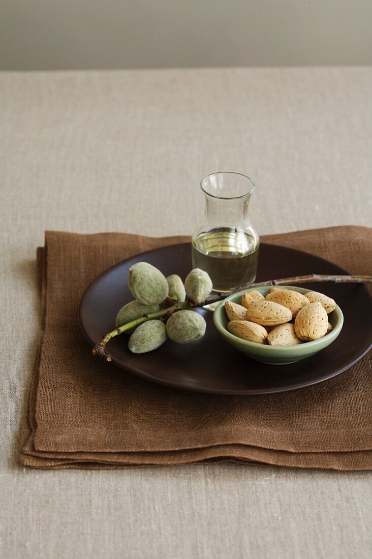 Fresh Almonds on Branch, Almond Oil and Almond in Shells