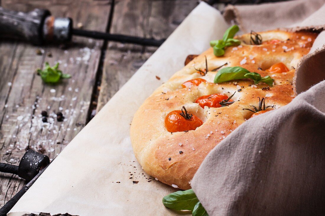 Italian focaccia bread with tomatoes and basil