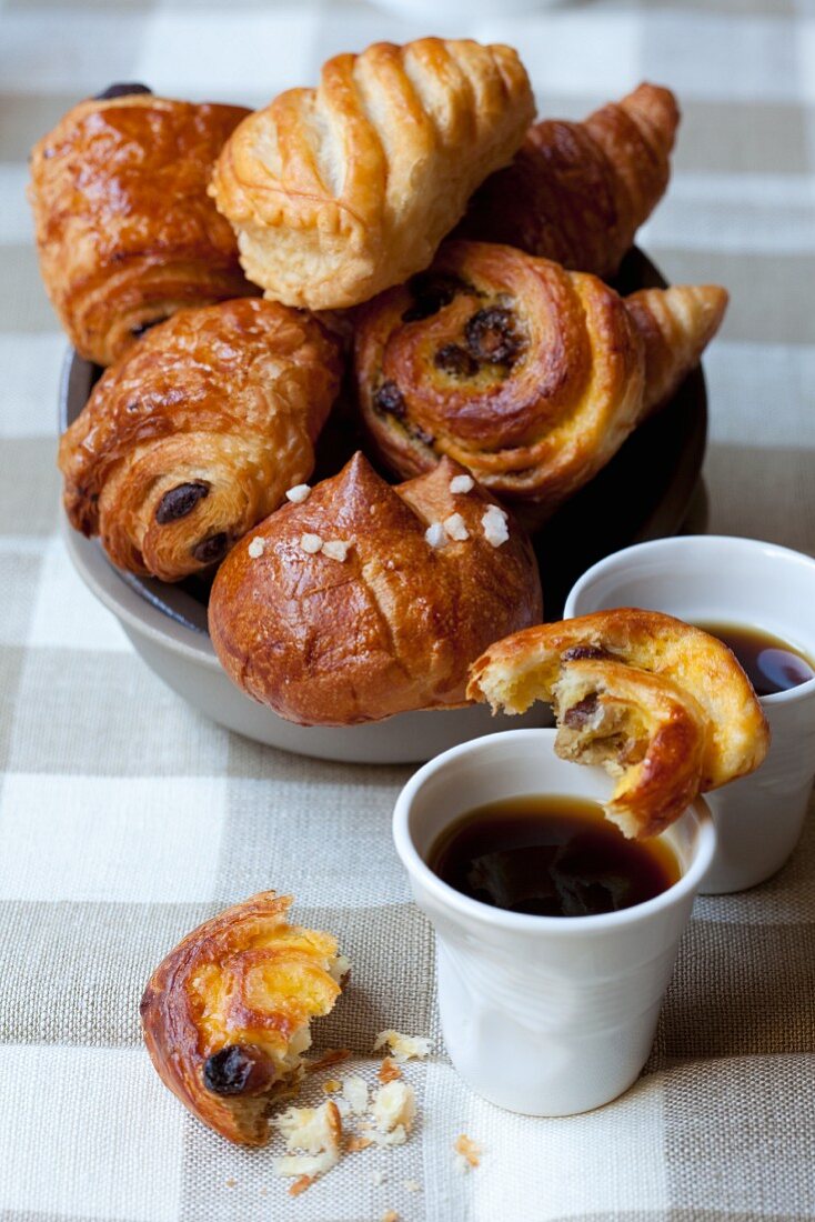 Sweet Danish pastries and cups of coffee