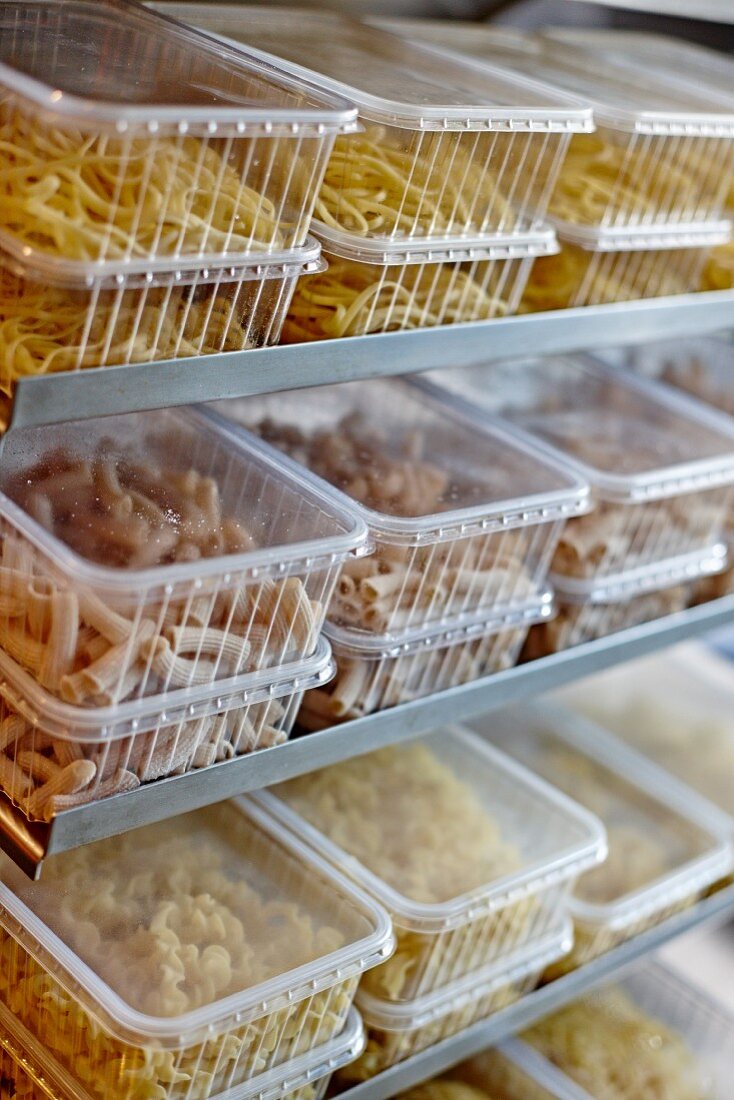 Assorted types of pasta in plastic containers