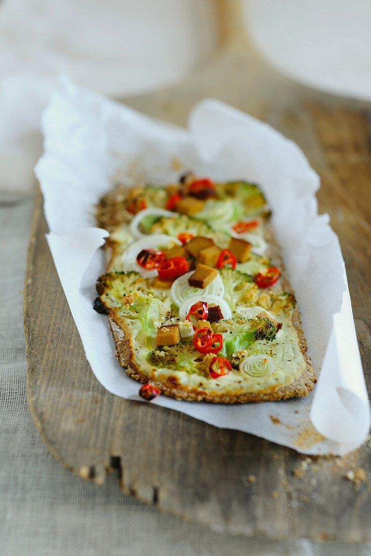 Flatbread topped with broccoli, chilli and onions