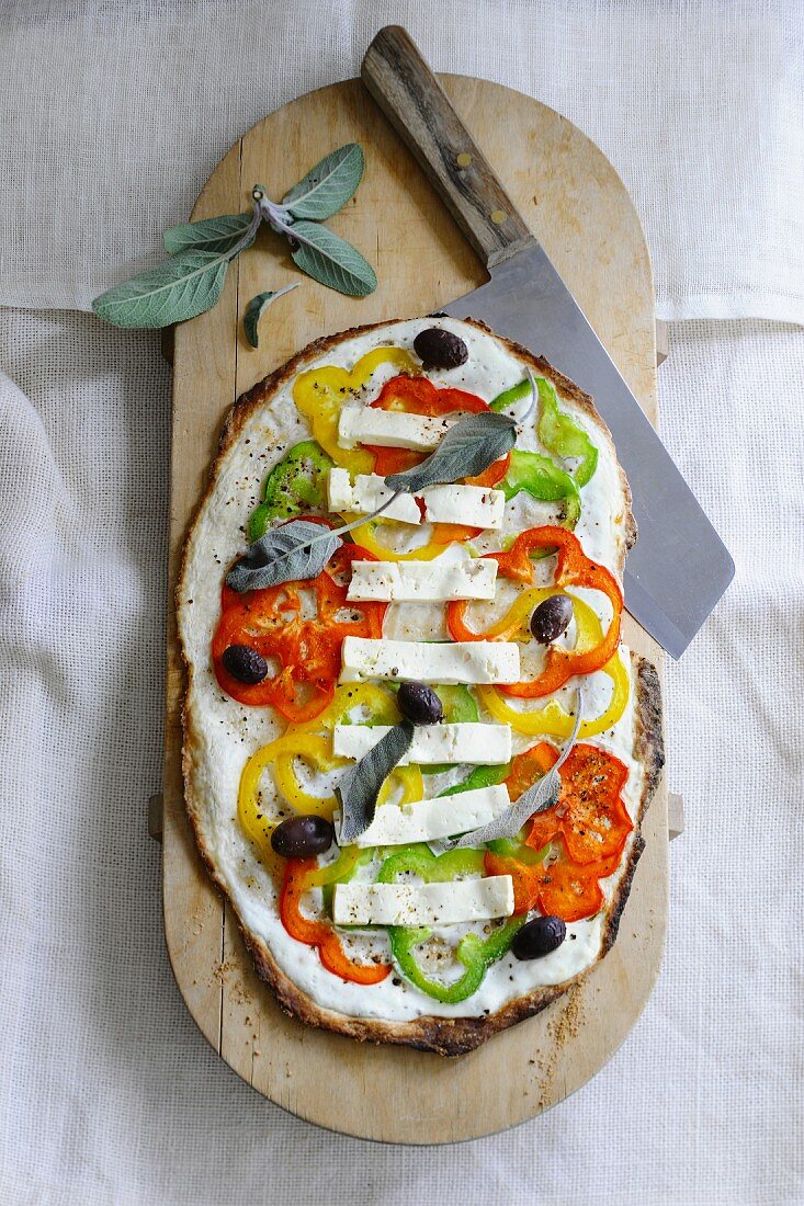 Flatbread topped with cream cheese, peppers, feta and sage