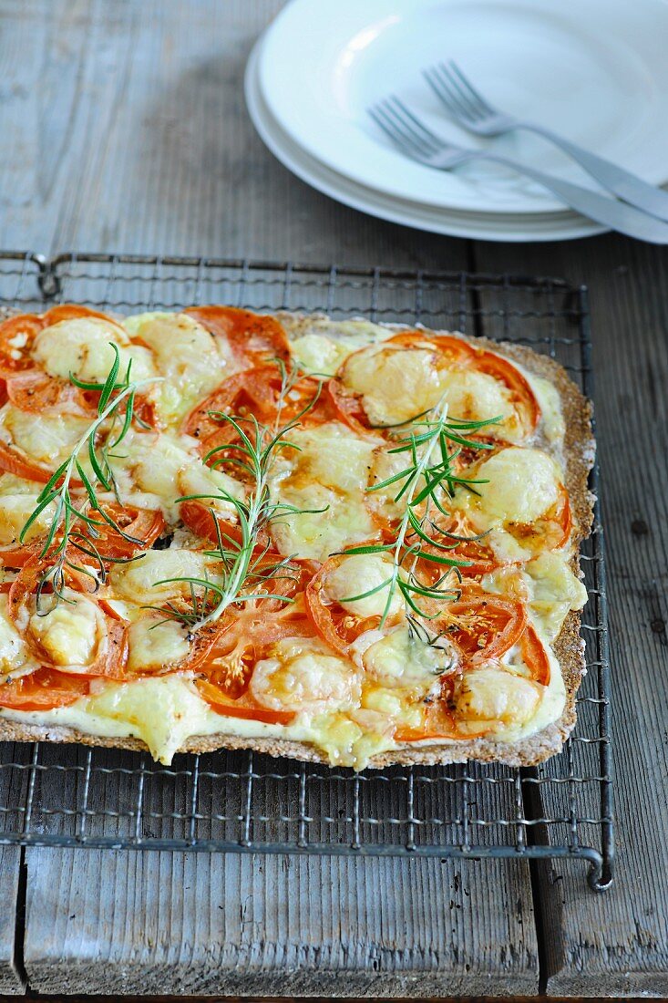 Flatbread topped with tomatoes, cheese and rosemary