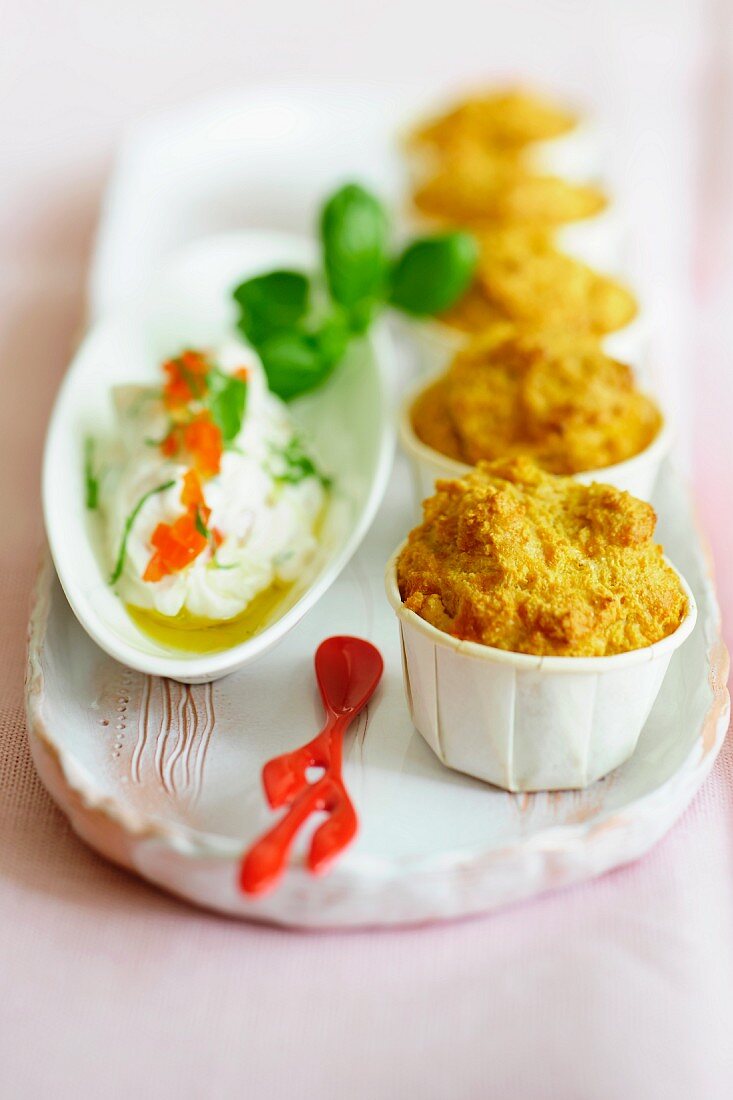 Cheddar muffins and creamy goat's cheese with olive oil