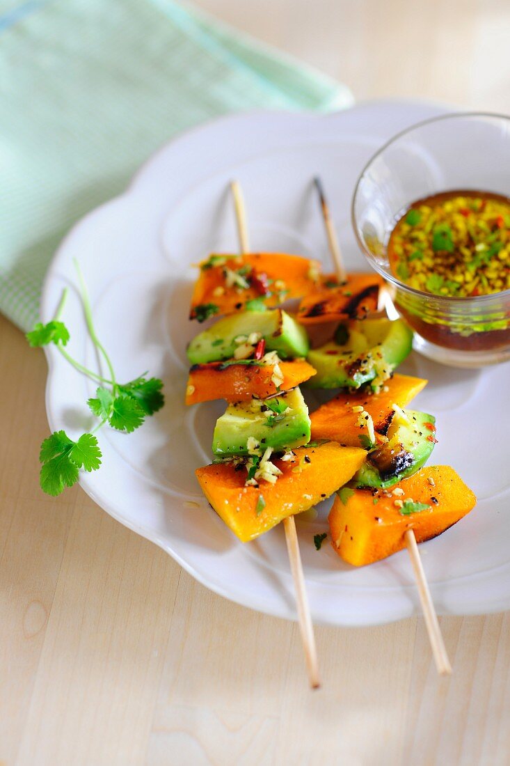 Barbecued skewers of squash and avocado