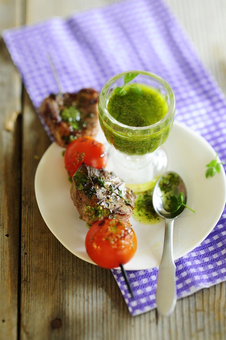 Grilled lamb and tomato kebab with pesto