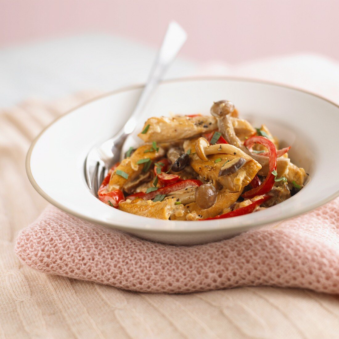 Pieces of chicken with mushrooms and peppers