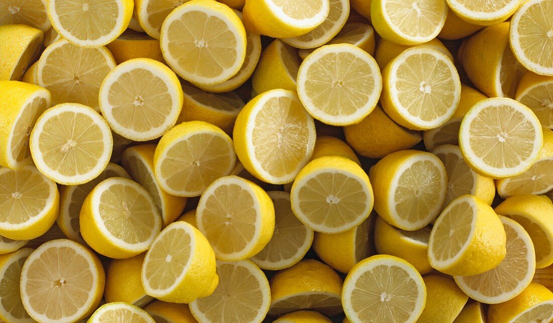 Lots of lemons cut in half (filling the image)