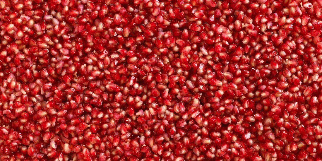 Lots of pomegranate seeds (filling the image)