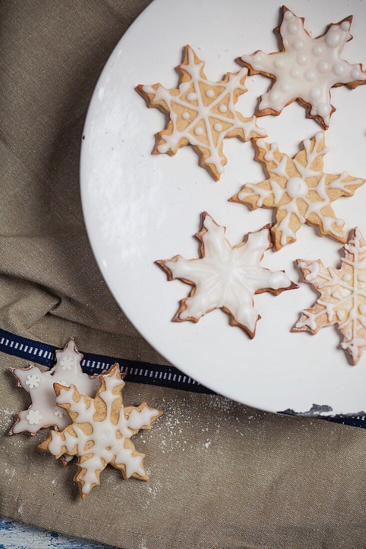 Decorated Christmas biscuits in the shape of snowflakes