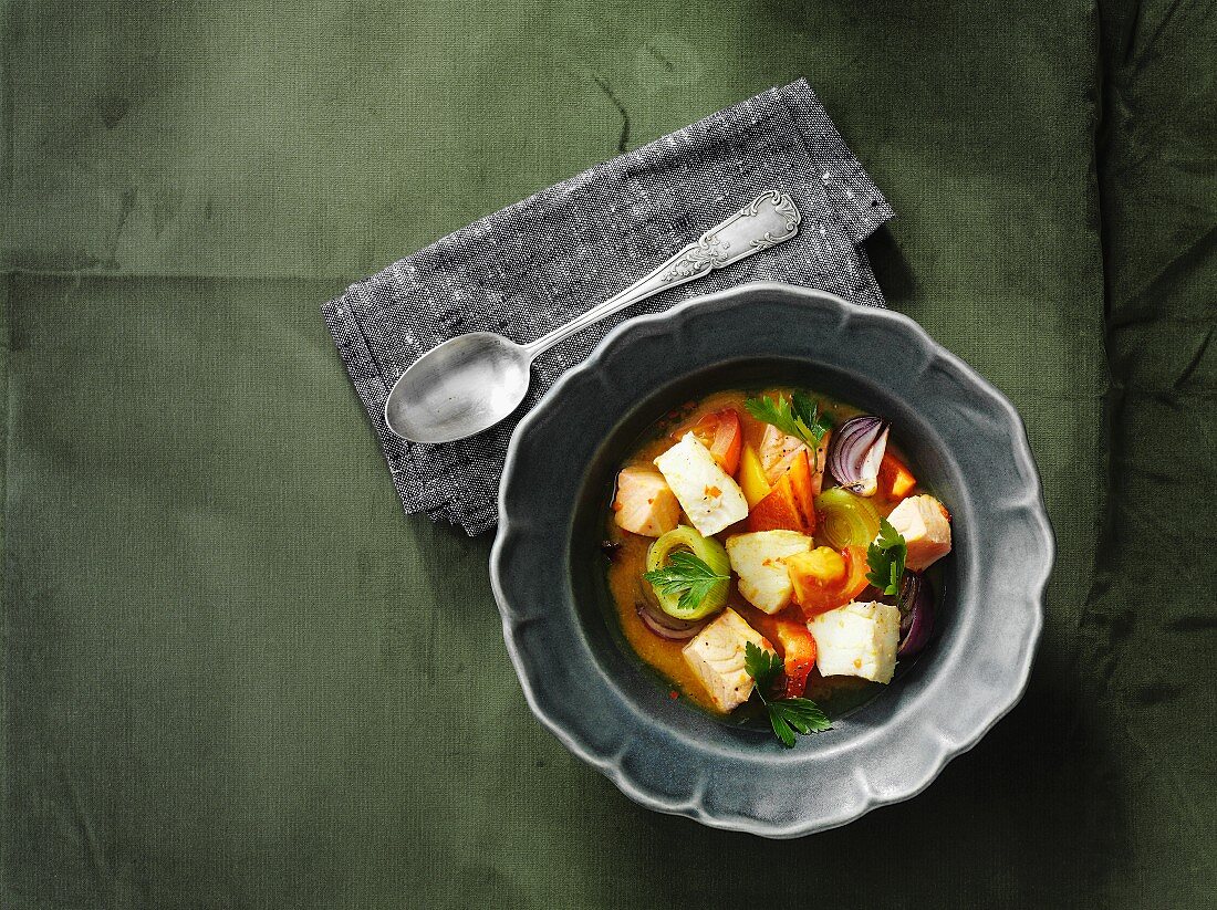 Fish soup with vegetables and parsley
