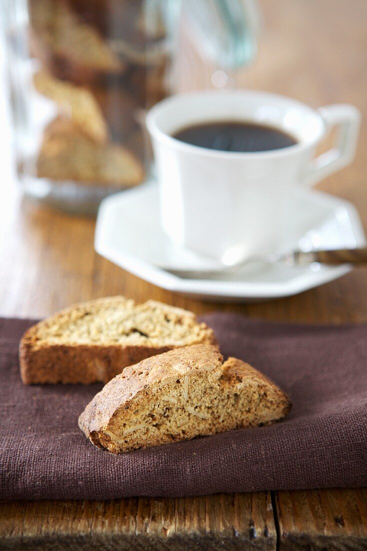 Almond biscotti biscuits served with a cup of black coffee