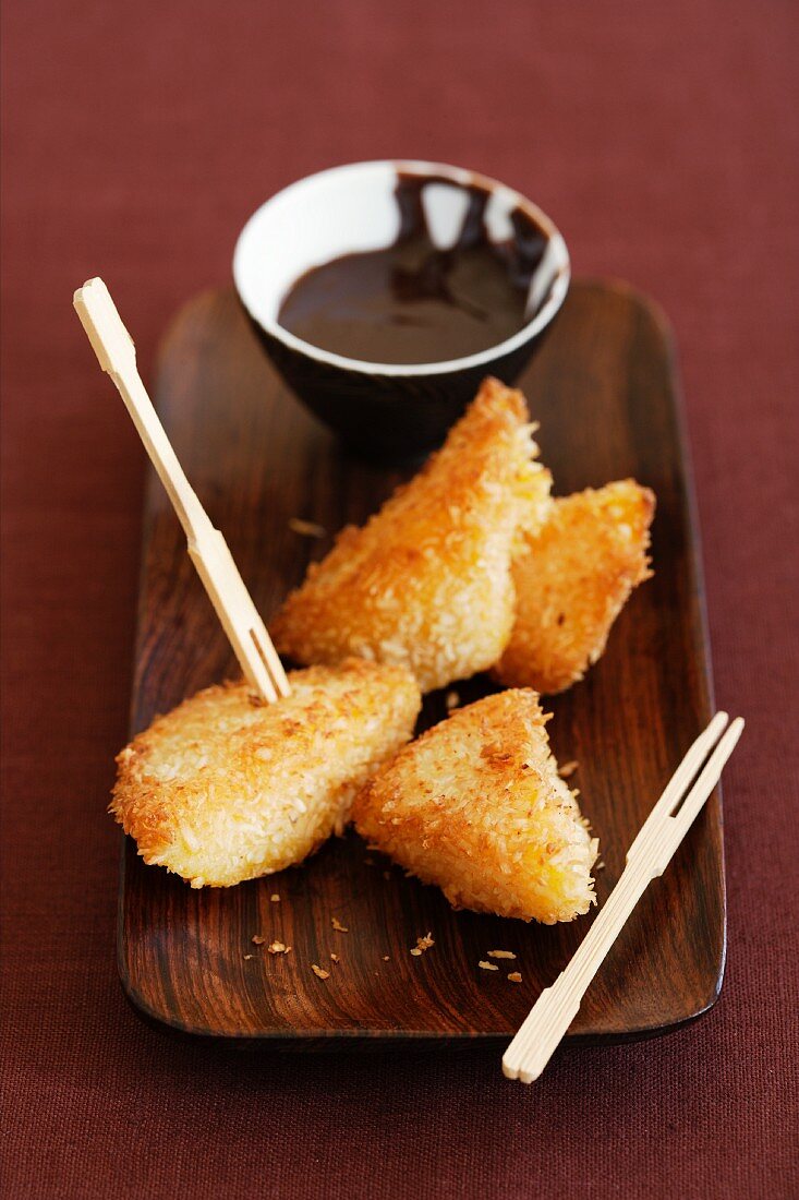 Deep-fried mango chunks in coconut crumb