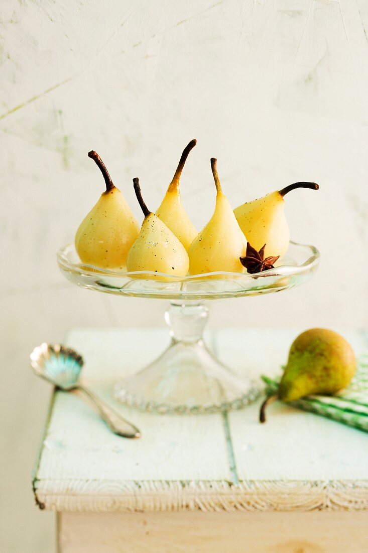 Spiced pears with star anise on a cake stand