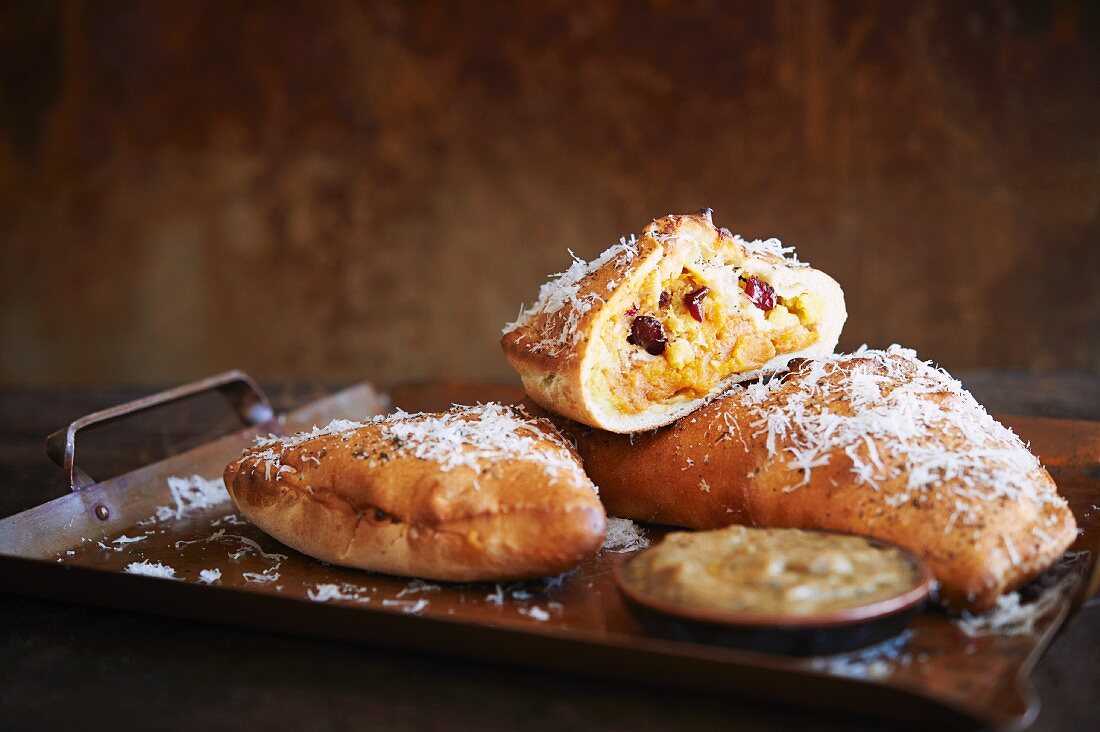 Thanksgiving Calzone with turkey, dressing, cranberry, and sweet potatoes.