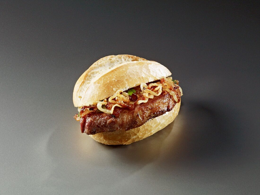 A bread roll filled with beef and onions