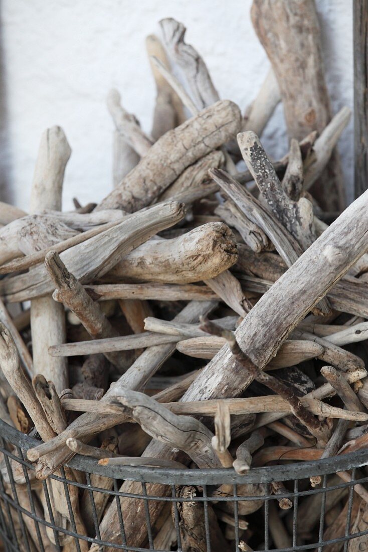 Driftwood in metal basket