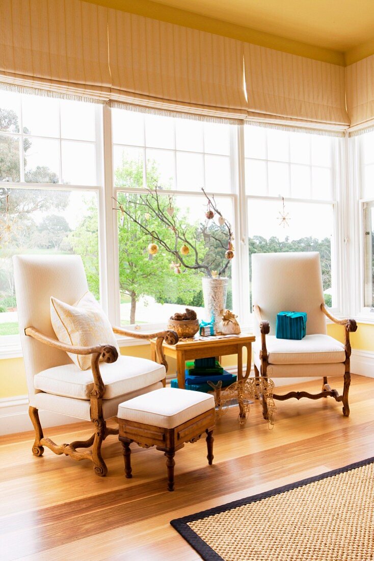 Elegant armchairs with table in the winter garden