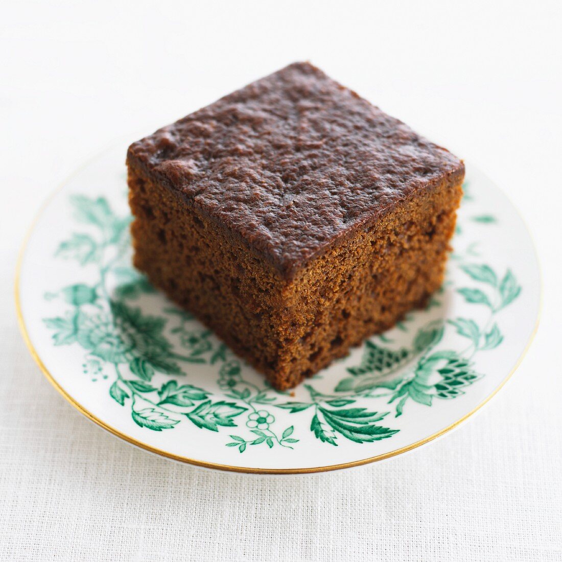 A piece of ginger cake on a plate