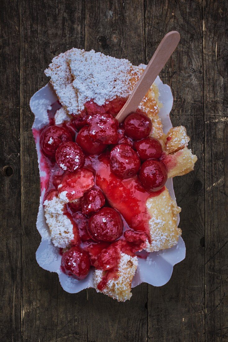 Kaiserschmarren (shredded sugared pancake from Austria) with warm cherries