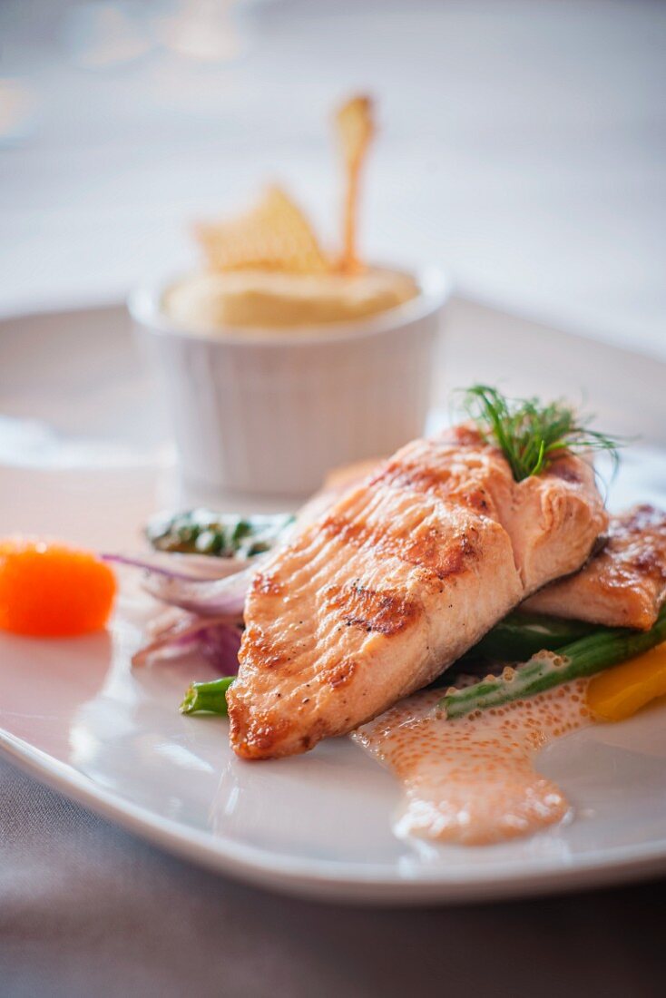 Salmon fillet on a bed of vegetables