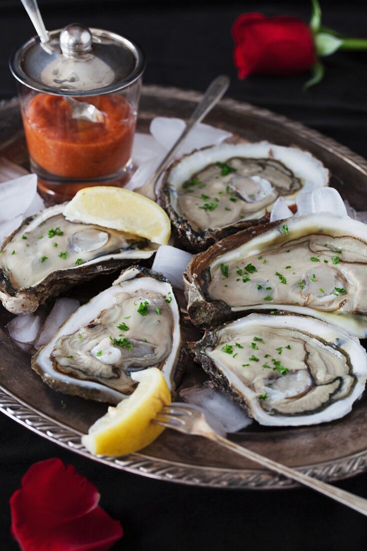 Oysters on a silver tray with ice