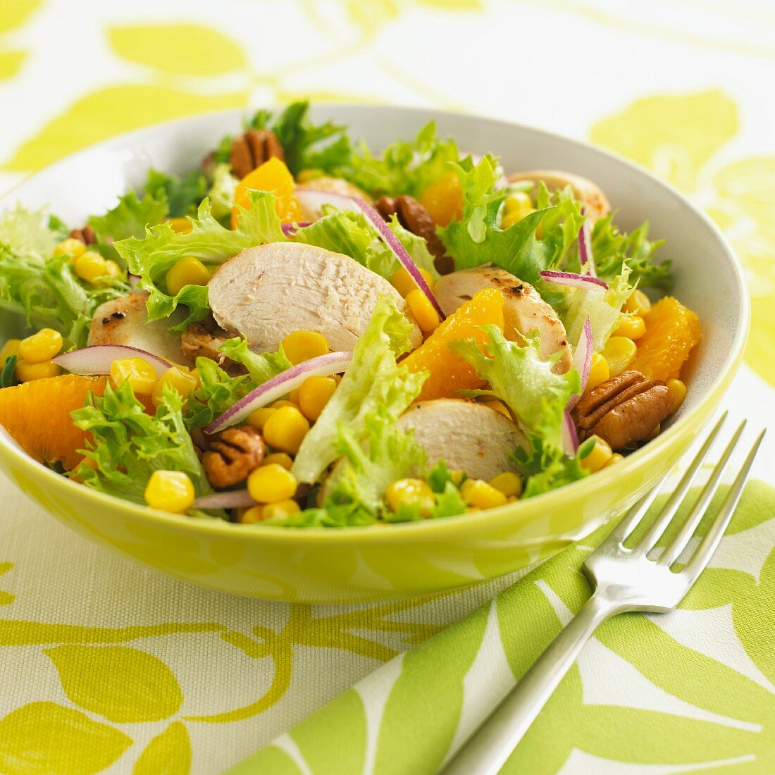 Lollo biondo lettuce with chicken oranges, sweetcorn and pecan nuts