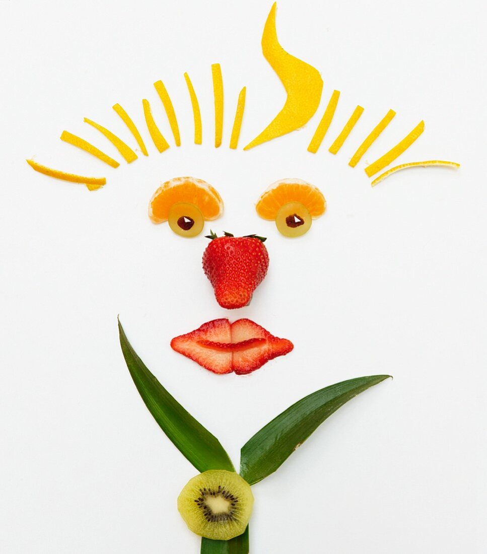 A smiling face made from fruit