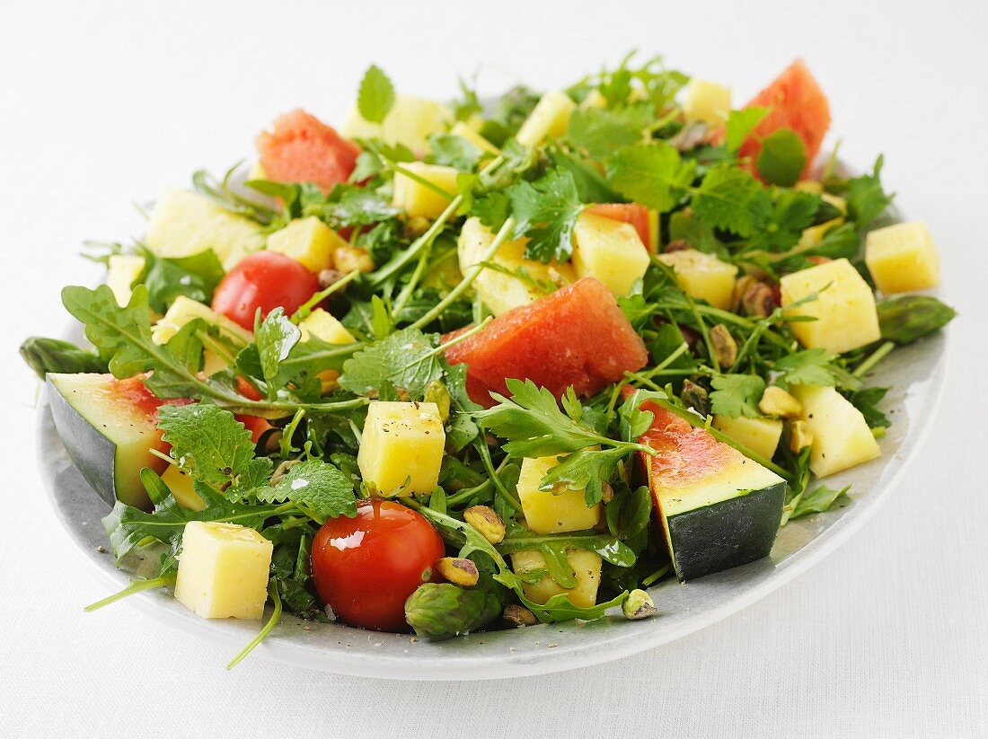 Summer salad with herbs, cheese and melon