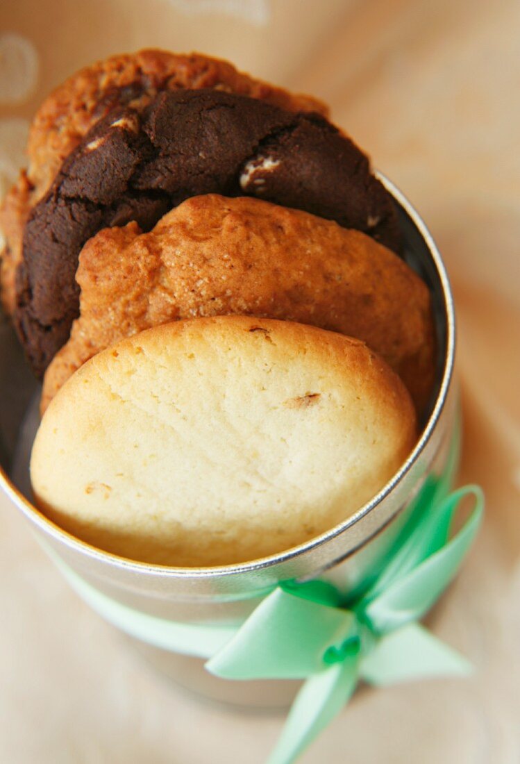 Silver Cookie Tin with Green Ribbon and Baked Cookies. From Above