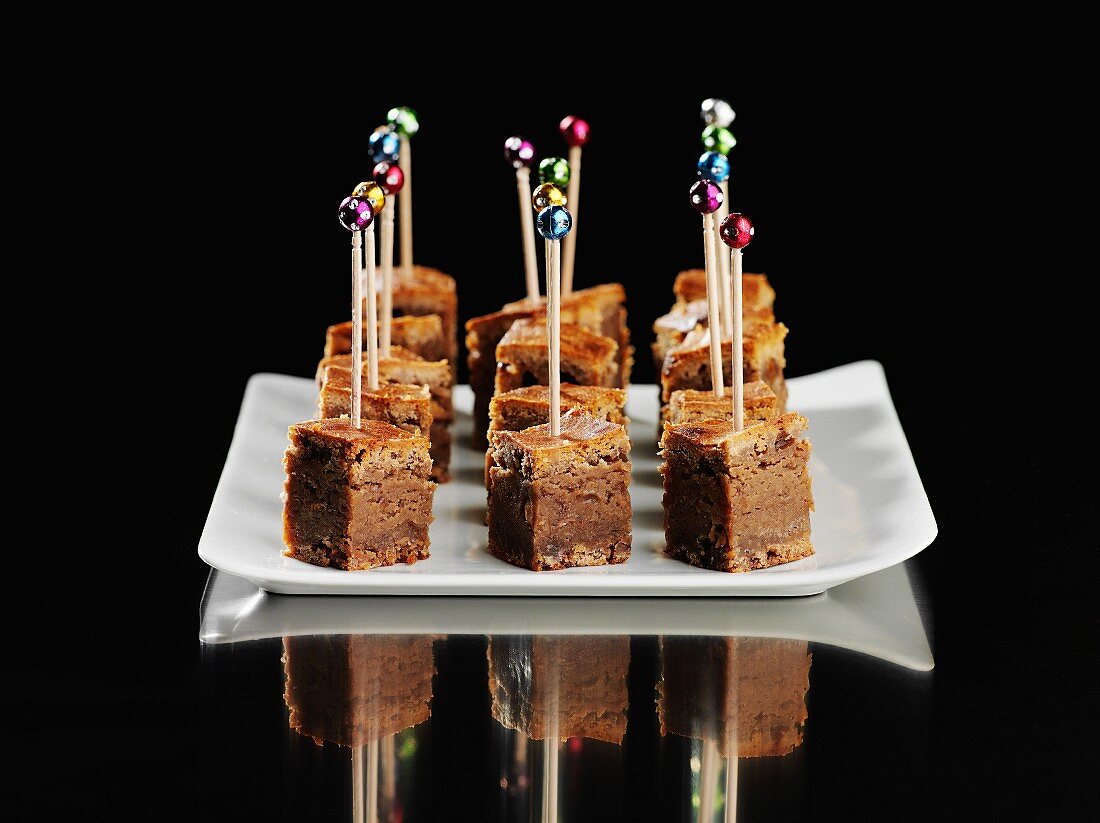 Caramel and chocolate squares on skewers